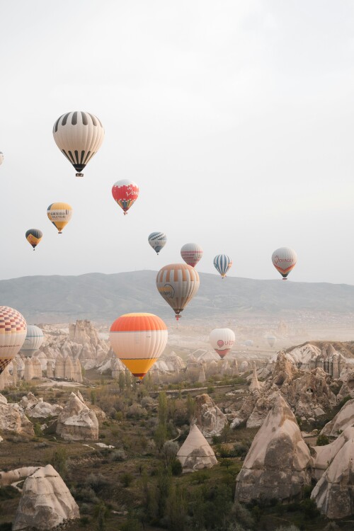 hot air balloons in the mountains